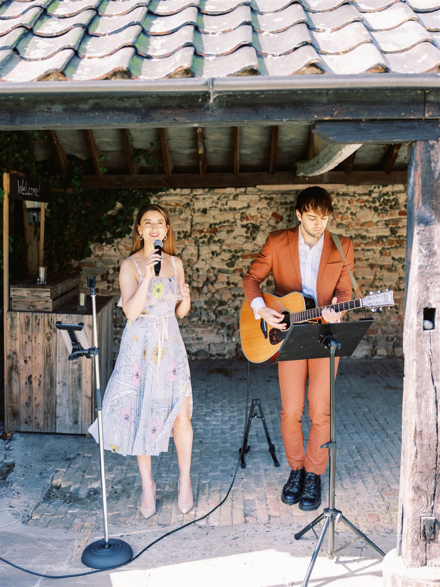 acoustic duo performing under shed roof